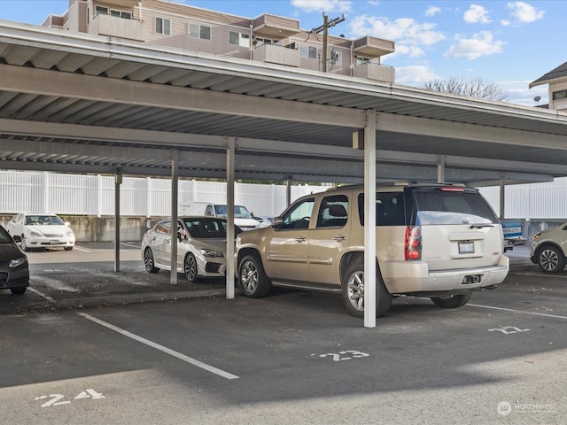 view of vehicle parking featuring a carport