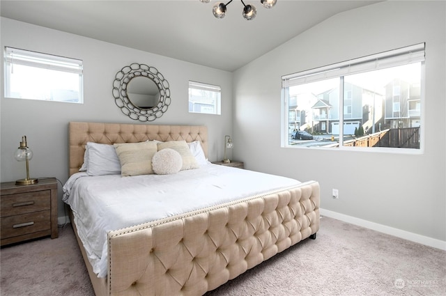 carpeted bedroom featuring lofted ceiling