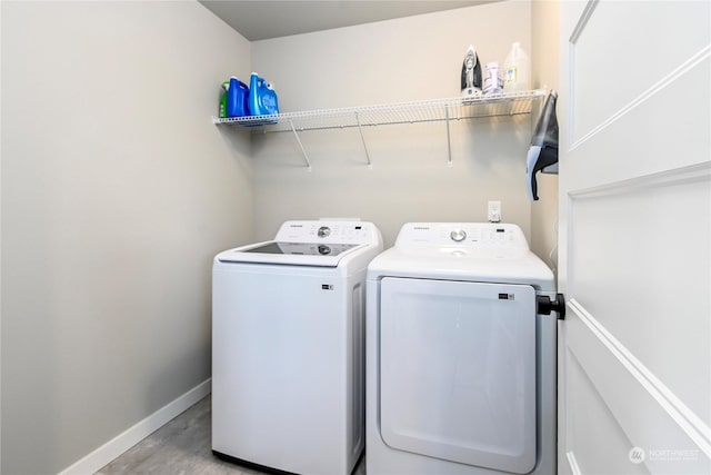 laundry room with washing machine and dryer