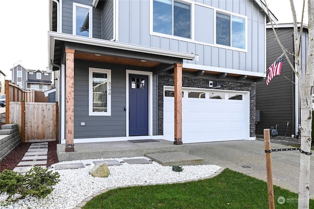 view of front of house with a porch and a garage