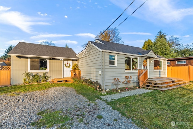 bungalow-style house with a front lawn