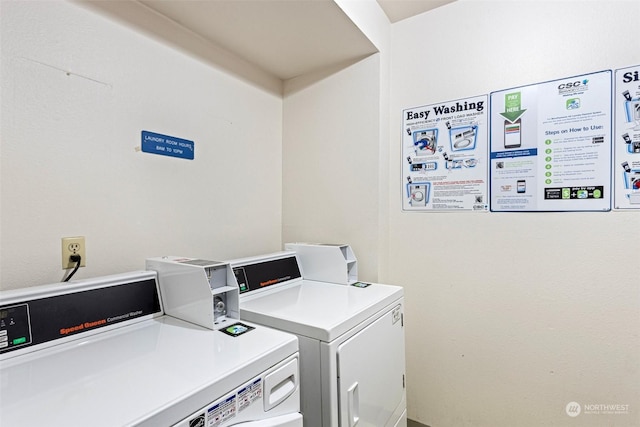 clothes washing area with independent washer and dryer