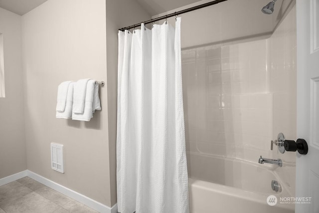 bathroom featuring tile patterned floors and shower / bath combo with shower curtain