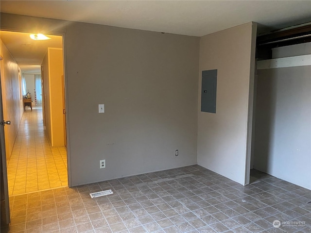 empty room featuring electric panel