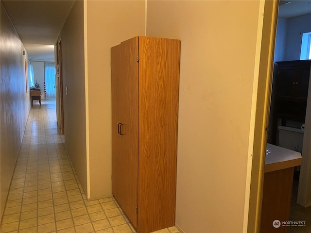 hallway featuring light tile patterned floors