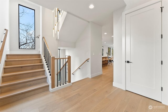 staircase featuring wood-type flooring