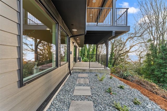 view of home's exterior featuring covered porch and a balcony