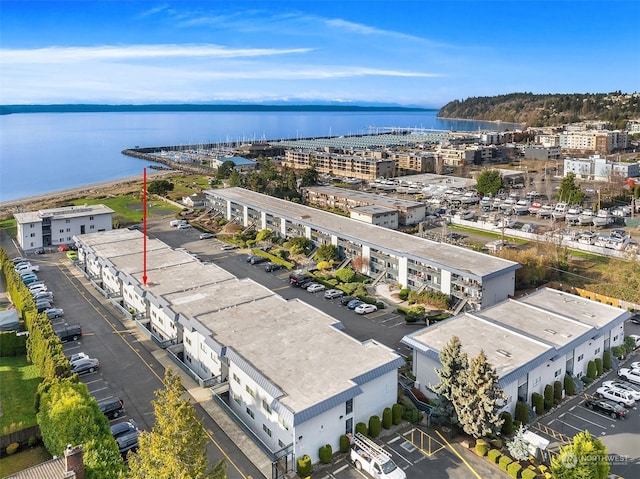 birds eye view of property with a water view