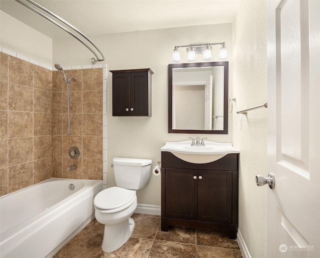 full bathroom with tile patterned floors, vanity, toilet, and tiled shower / bath