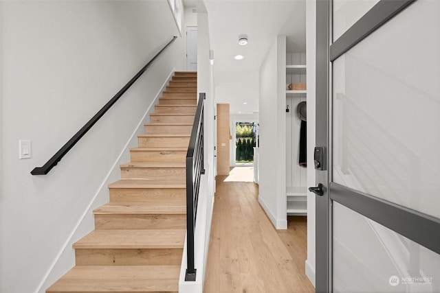 stairway with wood-type flooring