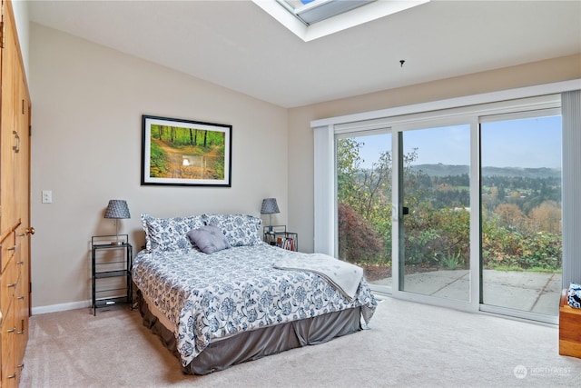 bedroom featuring carpet flooring, multiple windows, and access to exterior