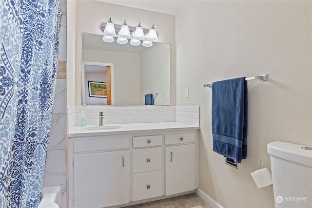 full bathroom featuring vanity, shower / tub combo, and toilet