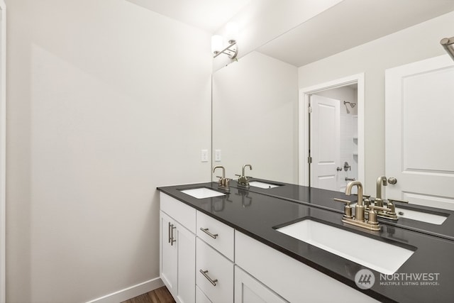 bathroom with vanity and hardwood / wood-style flooring