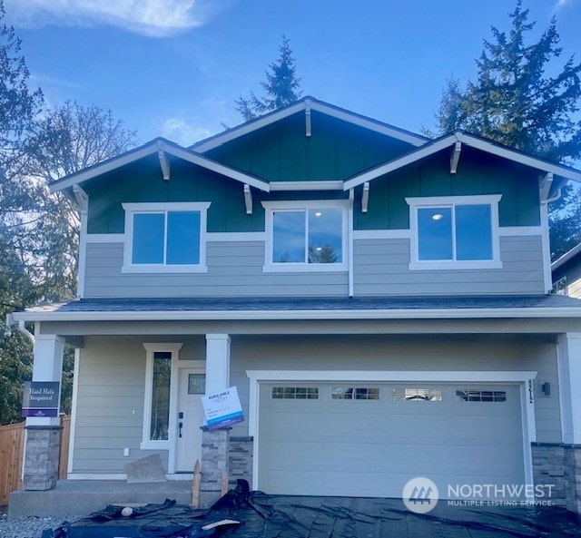 craftsman inspired home with a porch and a garage