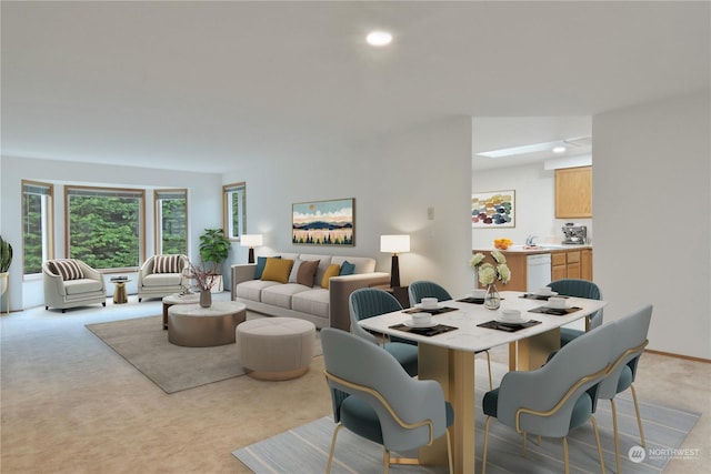 carpeted dining space featuring sink