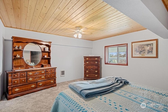 bedroom with ceiling fan, carpet floors, and wood ceiling