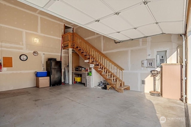 garage with black refrigerator