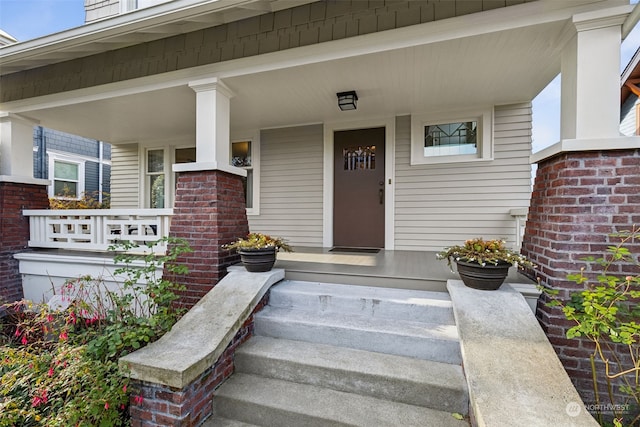 property entrance with covered porch