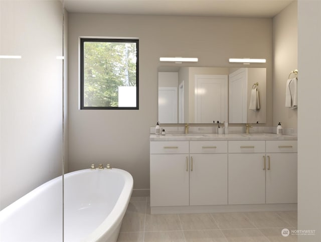 bathroom with tile patterned floors, a bathtub, and vanity