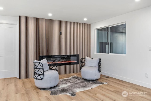 sitting room with light hardwood / wood-style floors