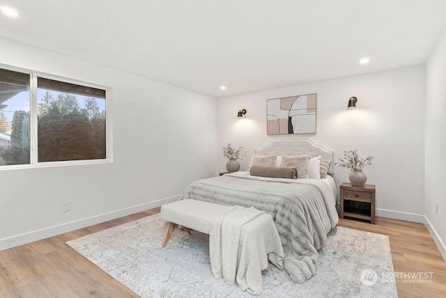 bedroom with hardwood / wood-style flooring