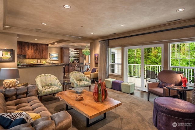 living area featuring wood finished floors and recessed lighting