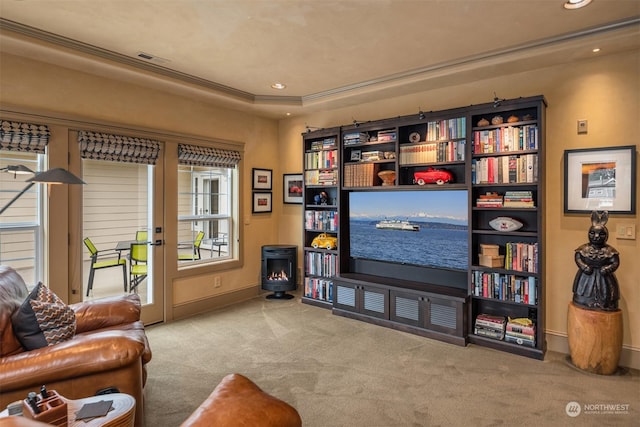 living room featuring carpet floors, french doors, a raised ceiling, and recessed lighting