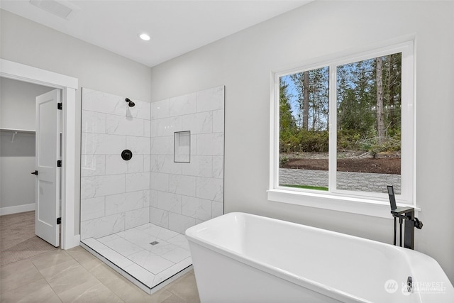 bathroom with tile patterned flooring and plus walk in shower