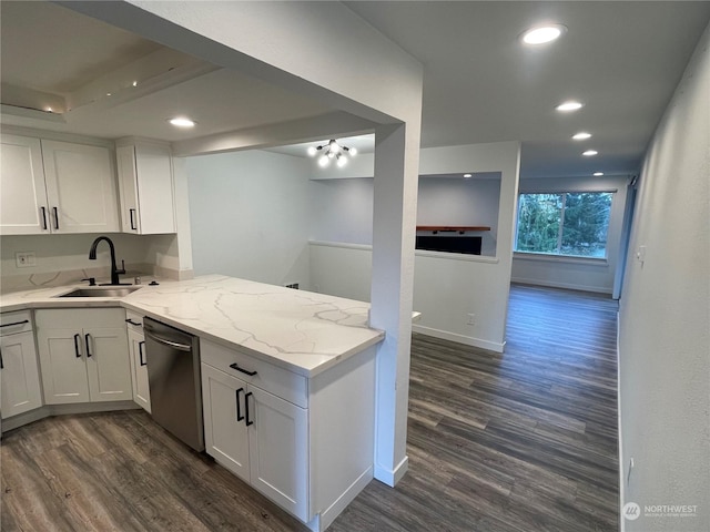 kitchen featuring light stone countertops, stainless steel dishwasher, sink, dark hardwood / wood-style floors, and white cabinetry