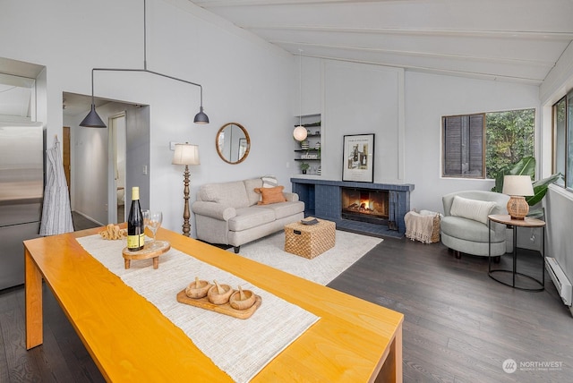 living room featuring vaulted ceiling with beams and dark hardwood / wood-style floors