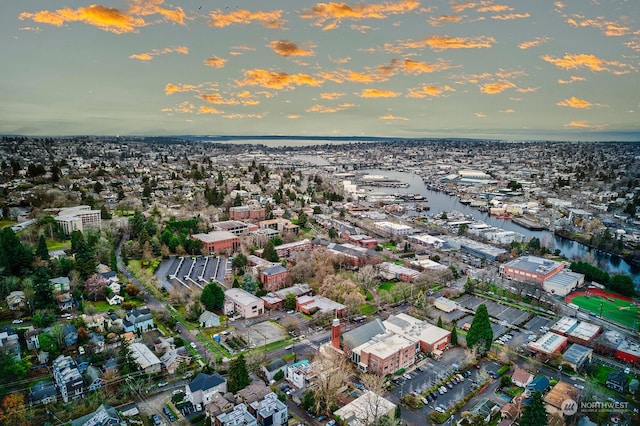 aerial view at dusk with a water view