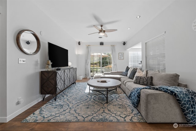 living room featuring ceiling fan and wood-type flooring