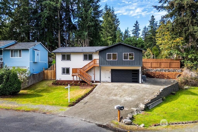 view of front facade with a front lawn and a garage