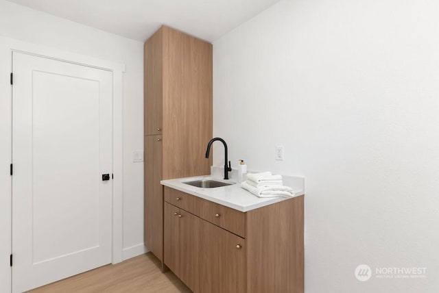 interior space featuring hardwood / wood-style floors and sink