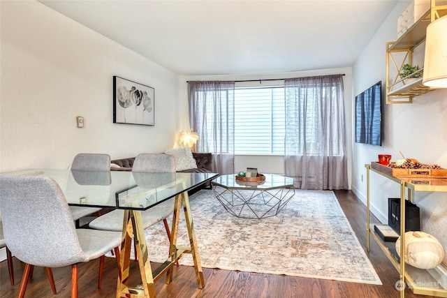 dining area with dark hardwood / wood-style flooring