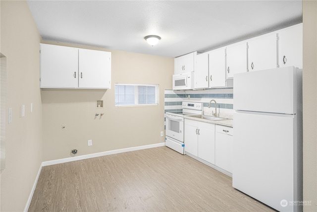 kitchen featuring decorative backsplash, white appliances, sink, light hardwood / wood-style floors, and white cabinetry