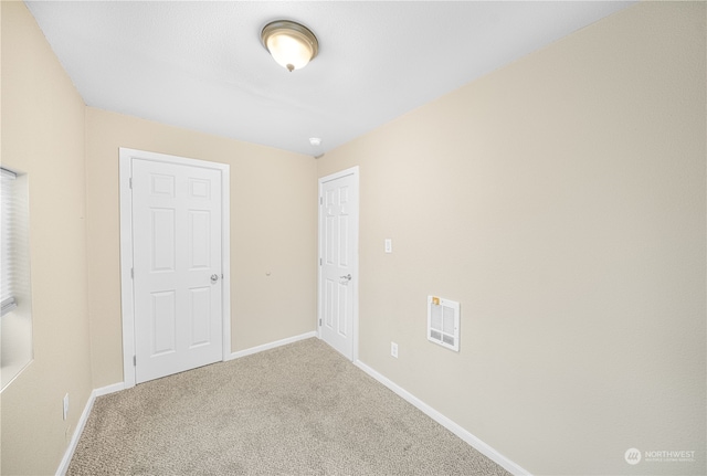 unfurnished bedroom featuring carpet floors and a closet