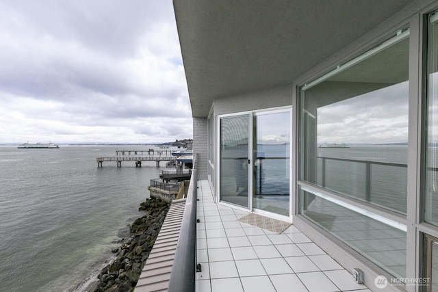 balcony featuring a water view