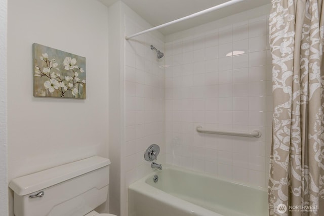 bathroom with shower / bath combination with curtain and toilet