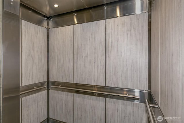 room details with recessed lighting and elevator