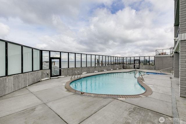 pool with a patio area