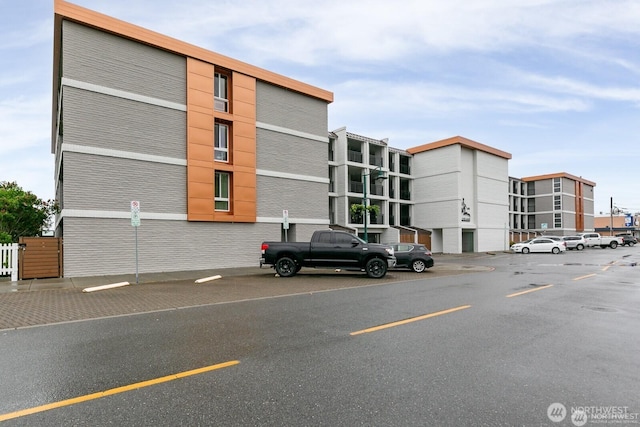 view of property with uncovered parking