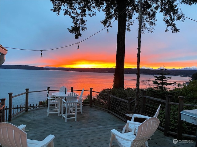 deck at dusk with a water view