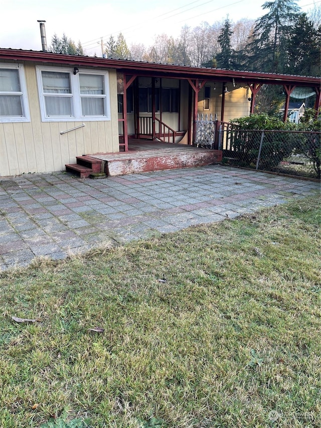 exterior space with a front yard and a patio