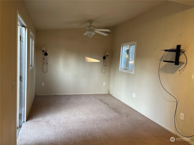 carpeted empty room with ceiling fan