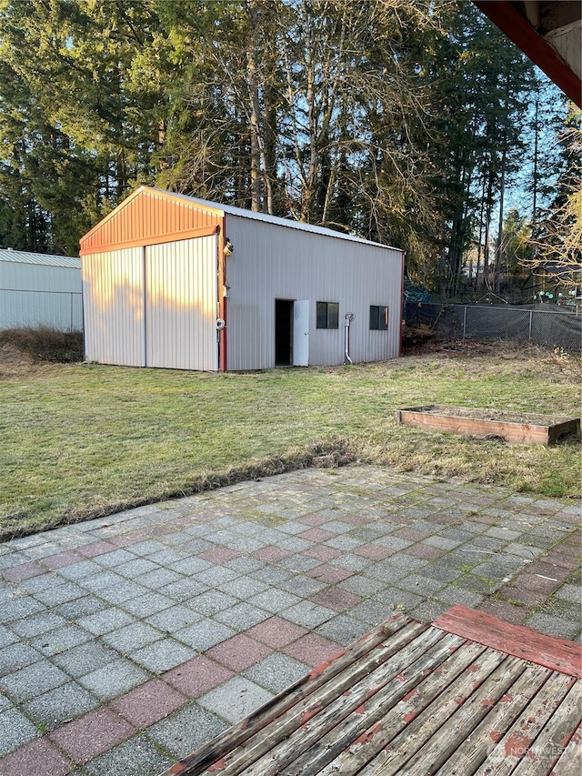 view of outdoor structure with a lawn