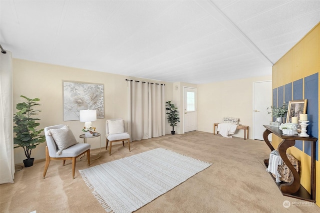 living area with light colored carpet