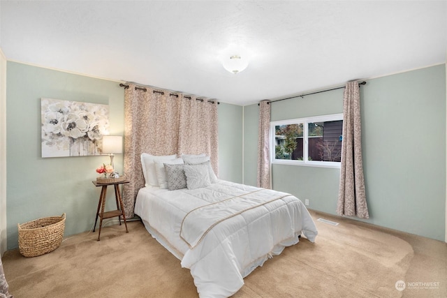 bedroom with light carpet