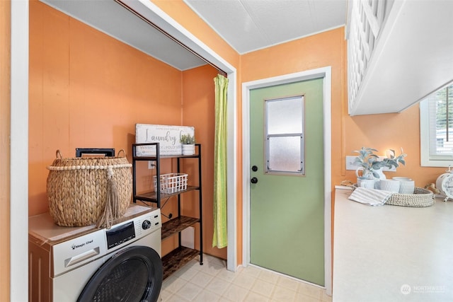 laundry area featuring cabinets and washer / dryer