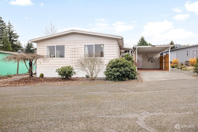 view of front of home featuring a carport